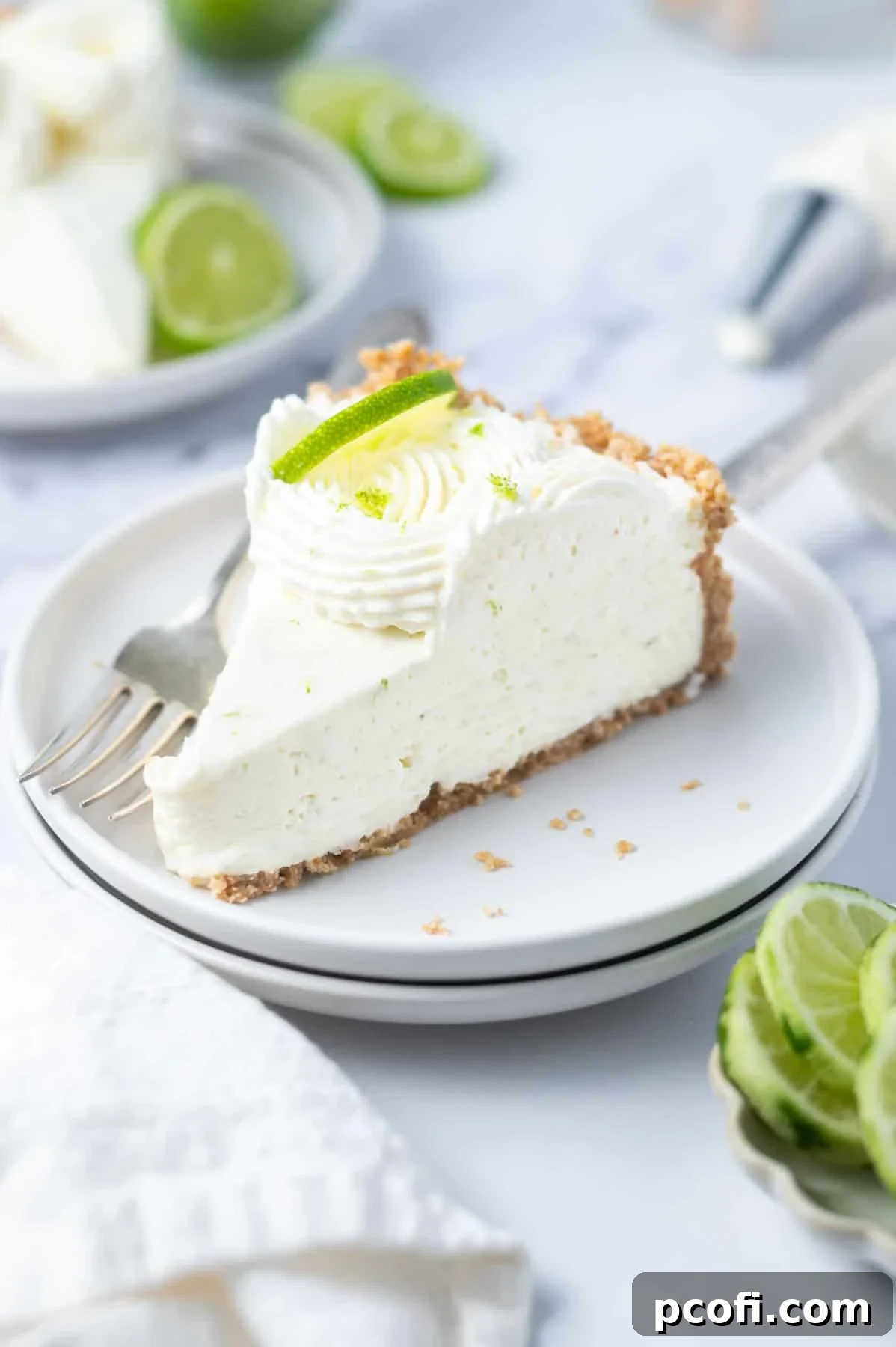 slice of cheesecake on a plate with a fork