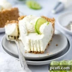 slice of cheesecake on a plate with a bite of it on a fork