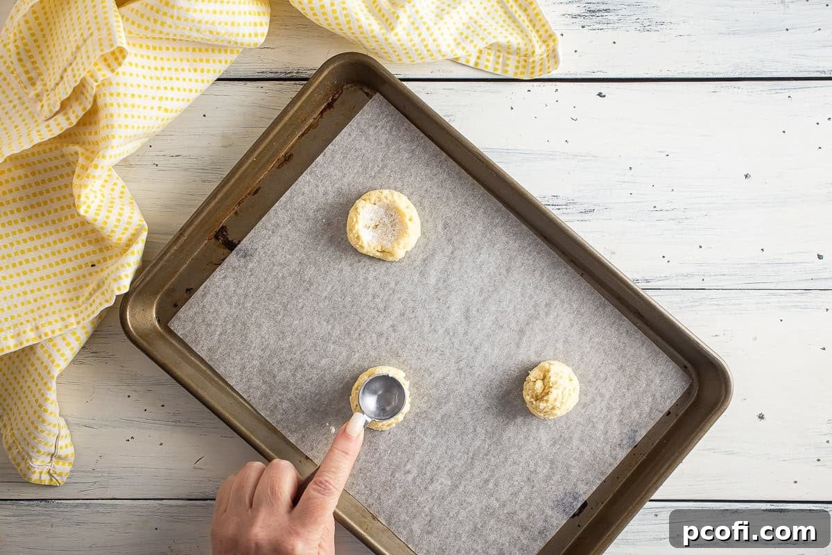 Shaping cookie dough for lemon meringue pie cookies.