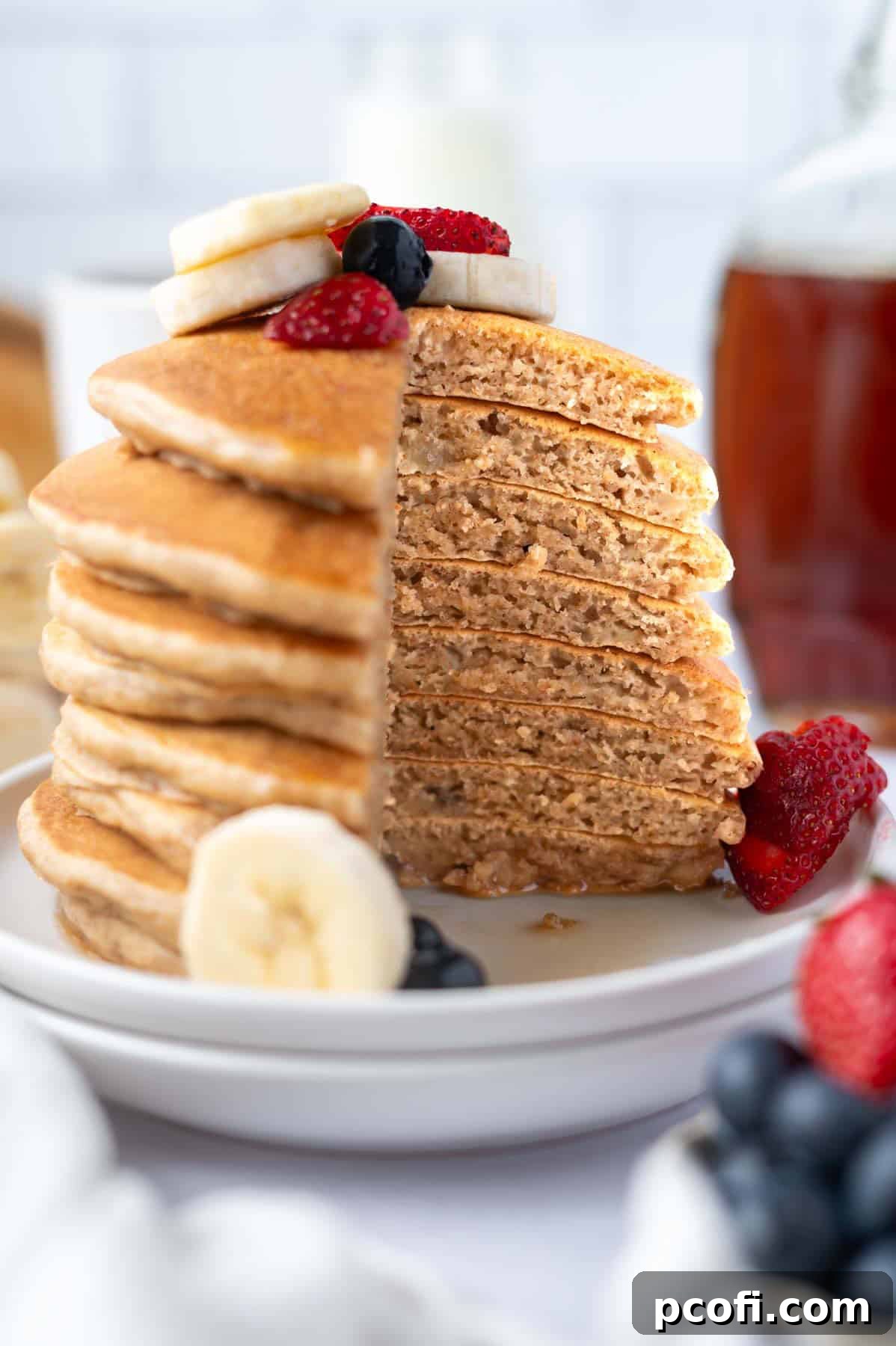 stack of banana pancakes cut to show soft, fluffy inside texture