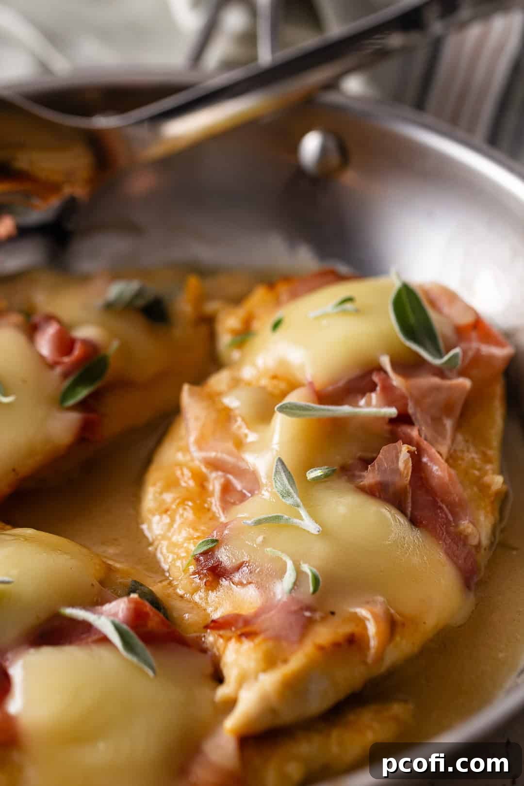 Chicken saltimbocca in a stainless steel skillet.