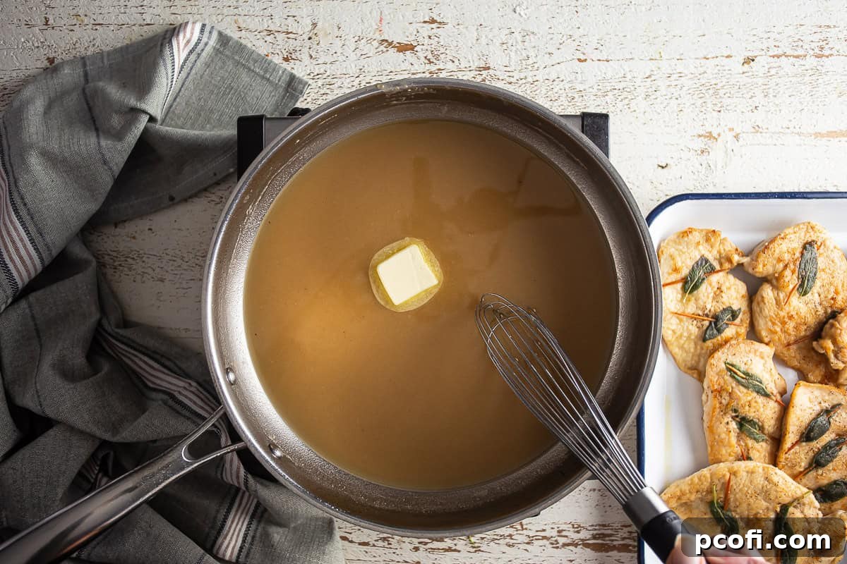 Adding butter to chicken saltimbocca sauce.